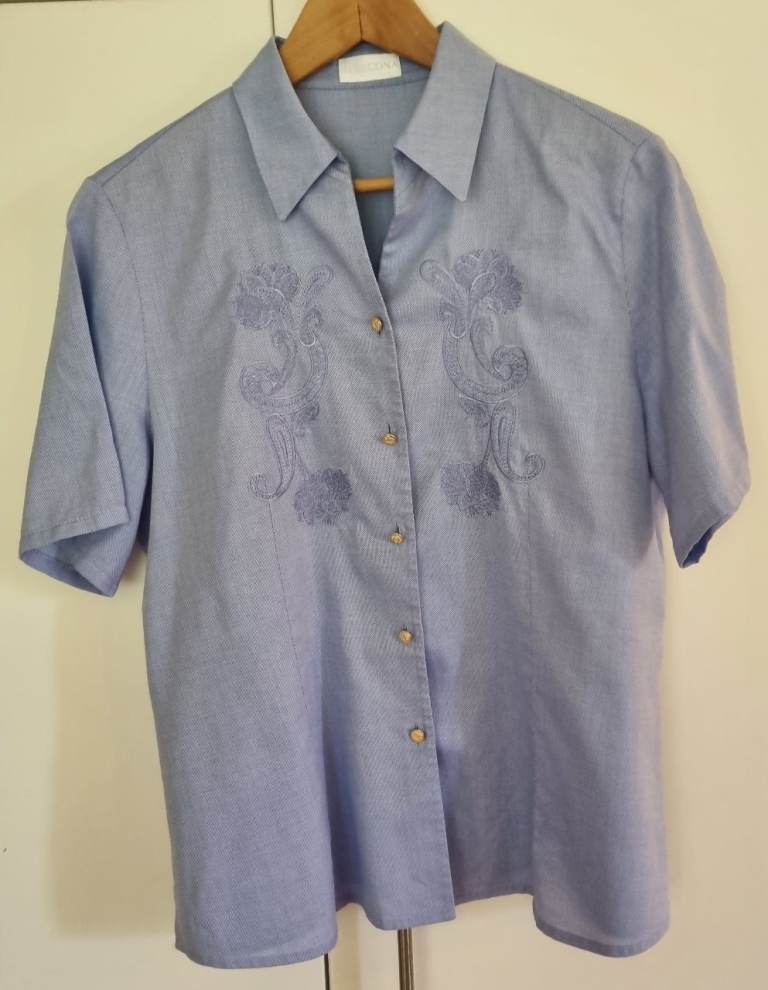 Marcona light blue short Sleeved shirt with pretty design on front. Size 16 VGC