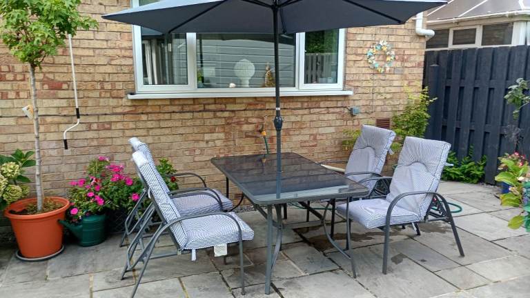 Patio set. Chairs, table footstools and parasol