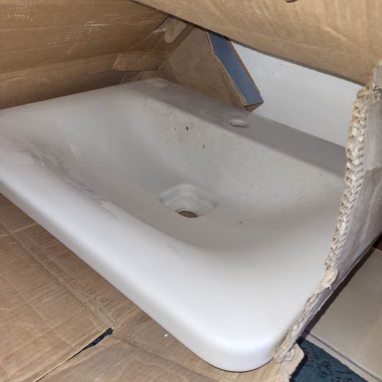 Ideal Standard white Sink with waste cover.