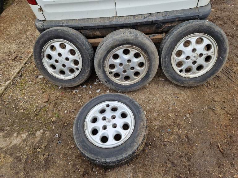 Ford 14" pepperpot alloy wheels with good tyres 