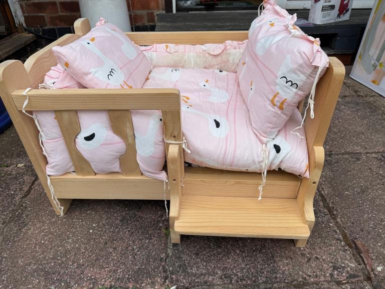 Pet wooden bed including cushion