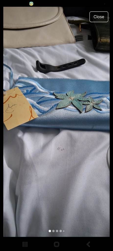 Blue floral clutch bag