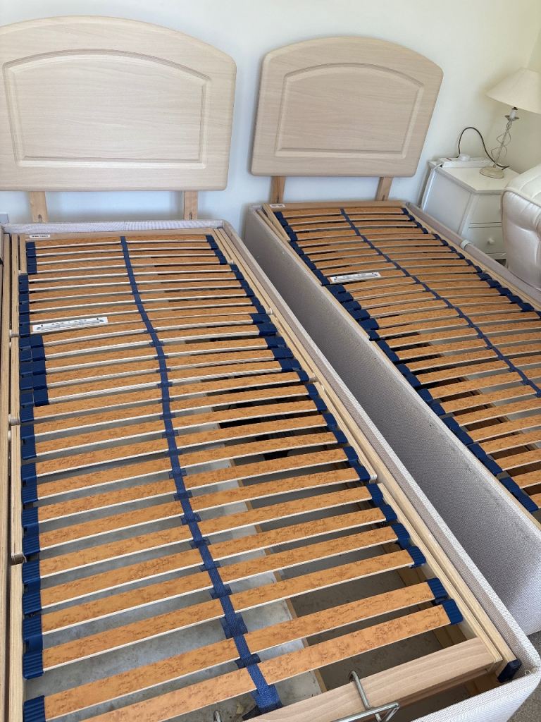 Two single electric reclining beds, good condition