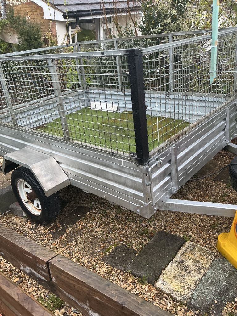 Seven by five ft caged single axle unbraked trailer,