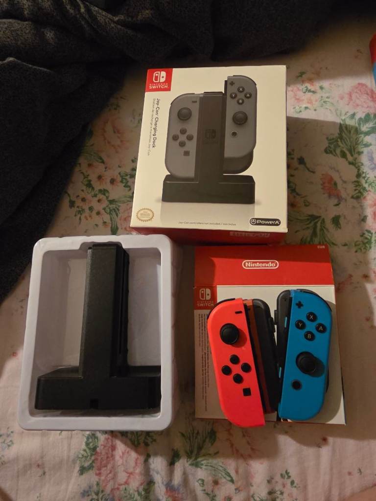 One set of Joy-Con switch controllers  / one Brand new charging dock 