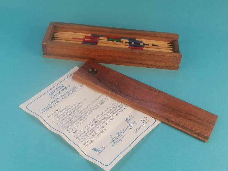Vintage Mikado pick-up sticks game set with wooden sticks, a box, and instructions