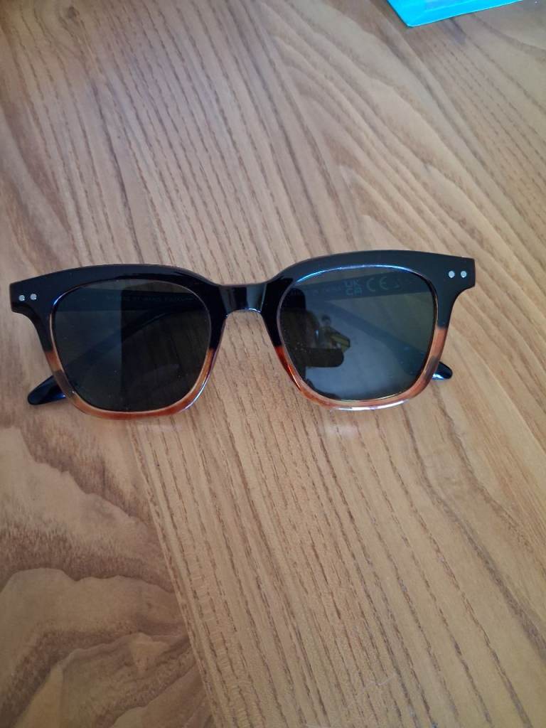Sunglasses.  Black top/brown at bottom.