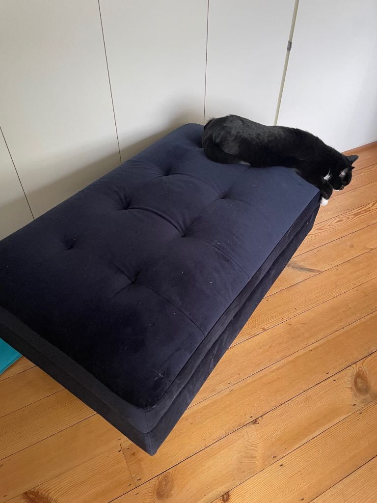 Large blue velvet storage ottoman