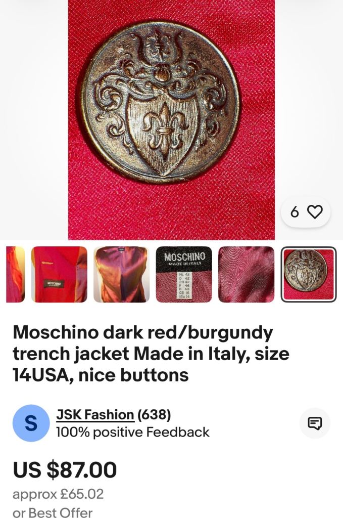 a vintage or antique military uniform button, possibly French, featuring a shield