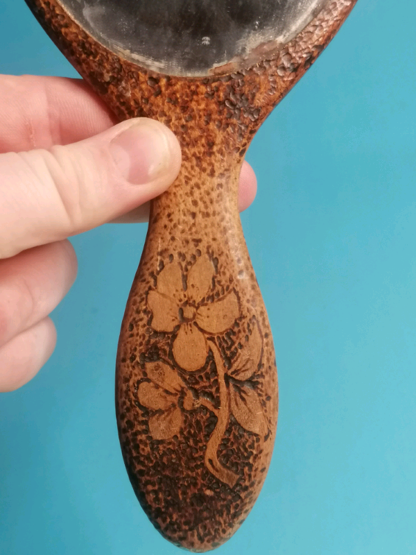 11-inch Antique carved wooden hand mirror. 