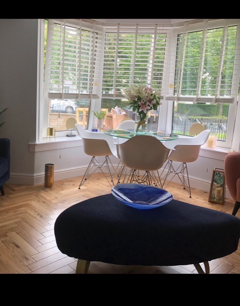 Clear Glass Dining Table and Four White Chairs