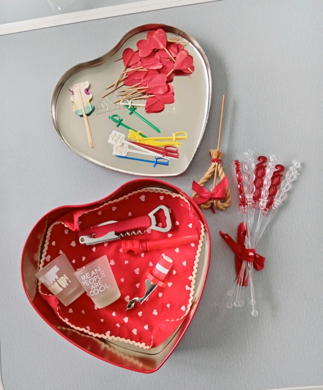 A Red Heart Shaped Chocolate Tin with Drinking Accessories.
