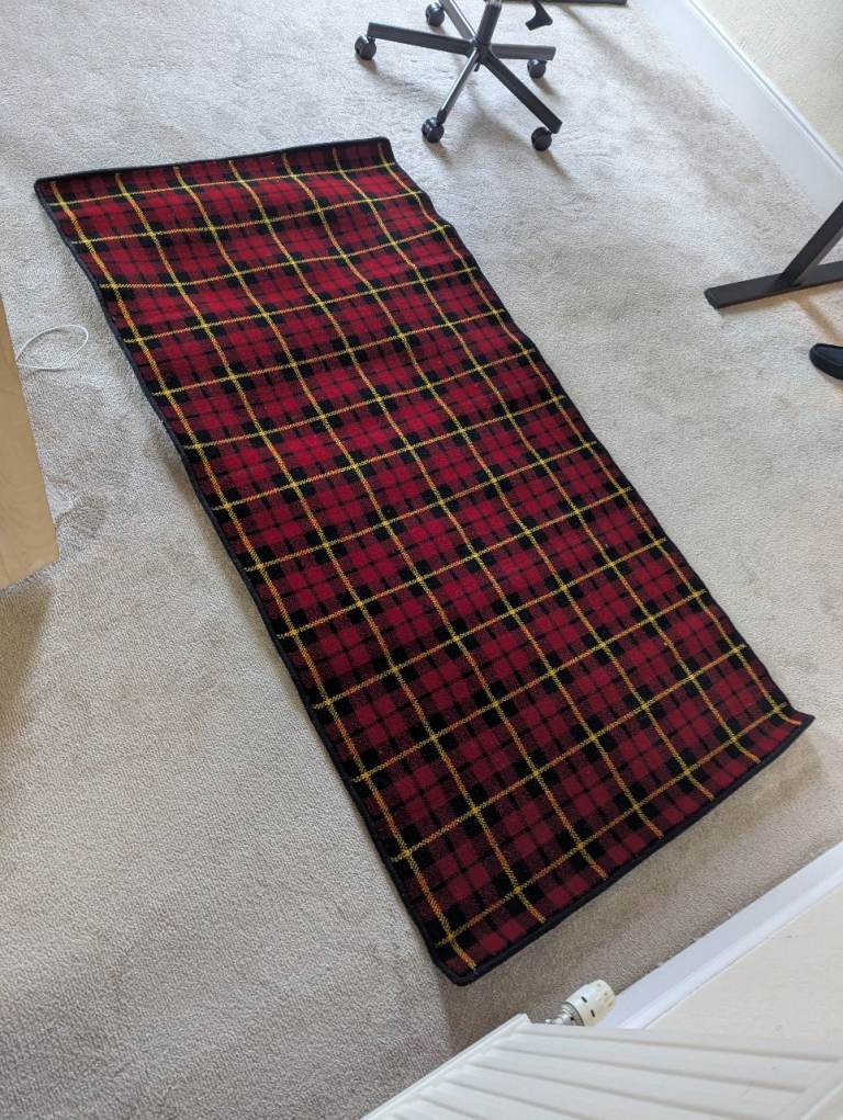 Rectangular red tartan rug, £50