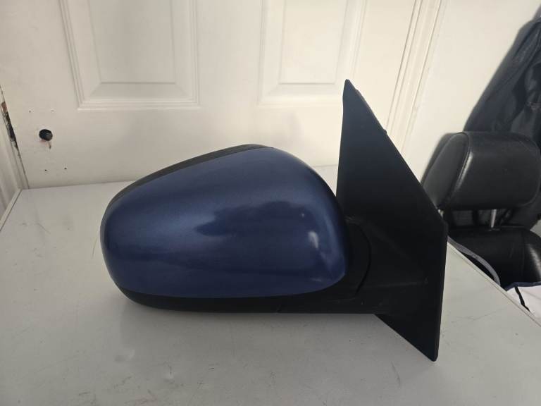 Nissan note  drivers side electric wing mirror.