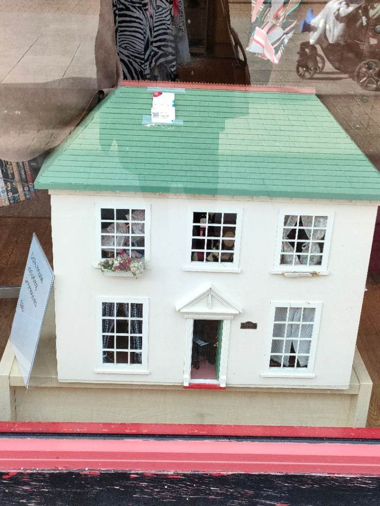 Charming White Wooden Dollhouse with Green Roof