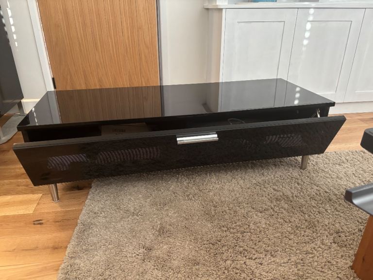 Black TV Stand with soft closing drop down door. 