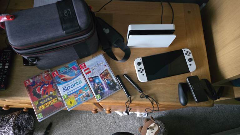 Nintendo switch OLED + 3 games + Travel case. (Still have original box.)