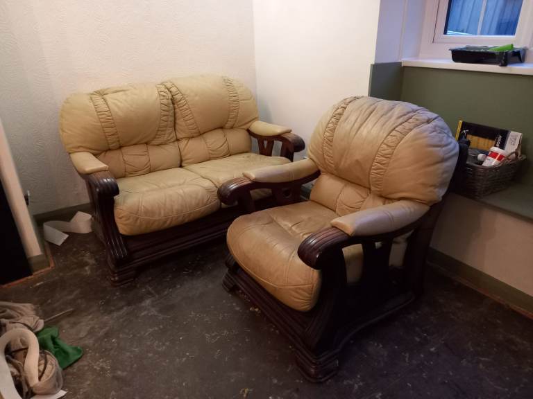 2 and 1 cream leather chairs sofas. Wooden frames.
