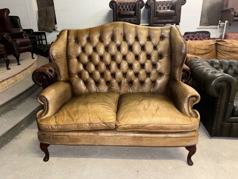 Chesterfield tan real leather wingback two seater sofa