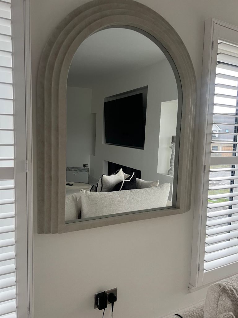 Luciana arched concrete over mantle mirror