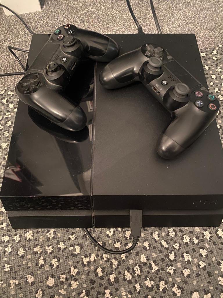 image for PS4 with 2 controllers and 2 games