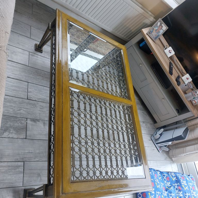 Vintage coffee table, iron legs and glass top 