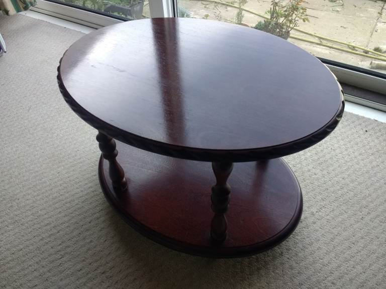  coffee table. Mahogany and mahogany veneer two layer oval coffee table.