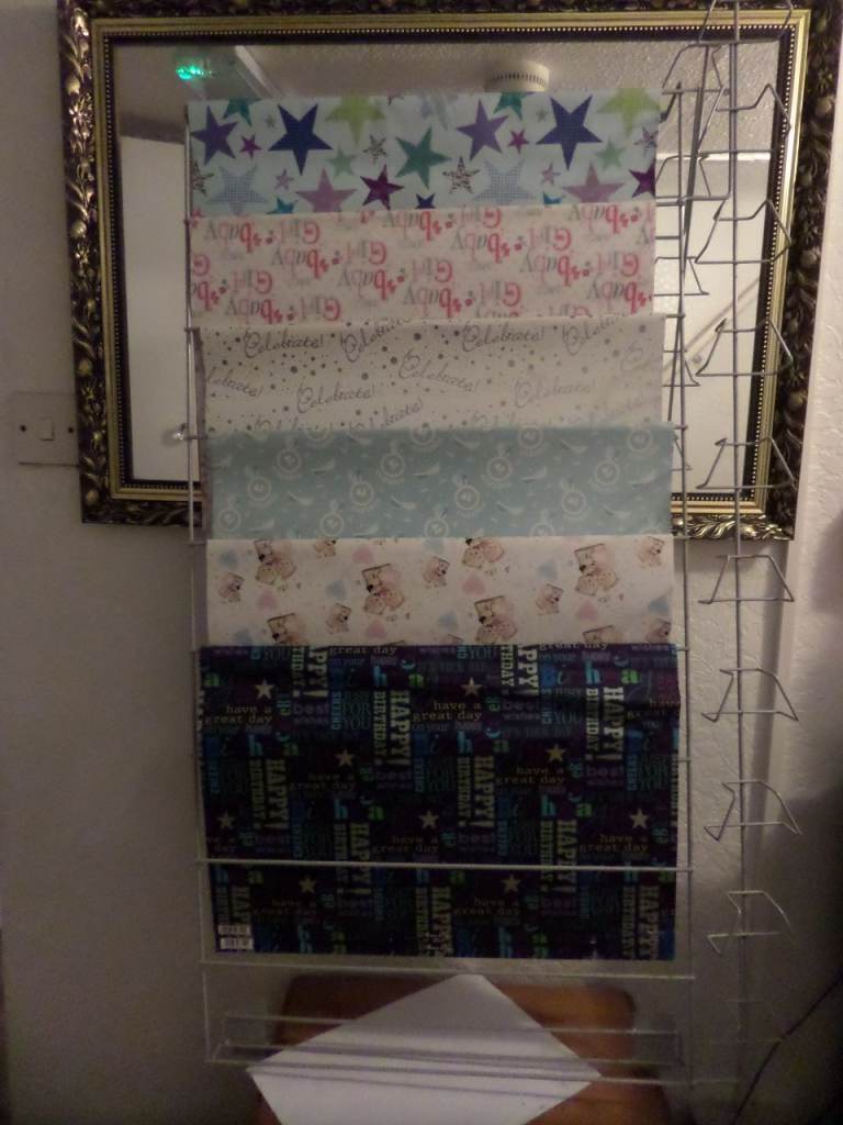 Slat-wall gift wrap display