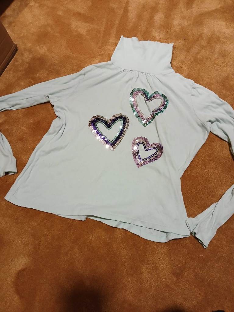 Light green girl's turtle neck top