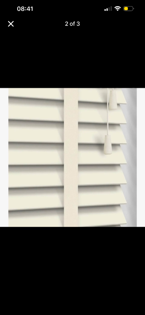 Cream taped Venetian blinds several drops 