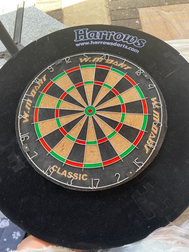 Dartboard, surround and professional mat. 