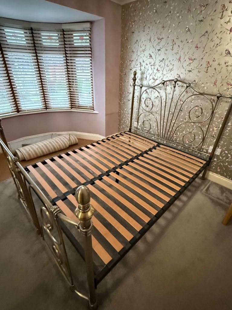 Antique brass effect king sized metal bed frame.