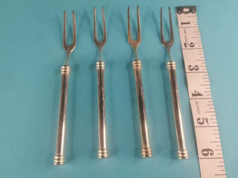 Vintage pickles forks. As seen.