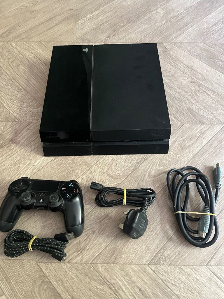 Sony PlayStation 4 Console with Controller and Cables – Good Condition