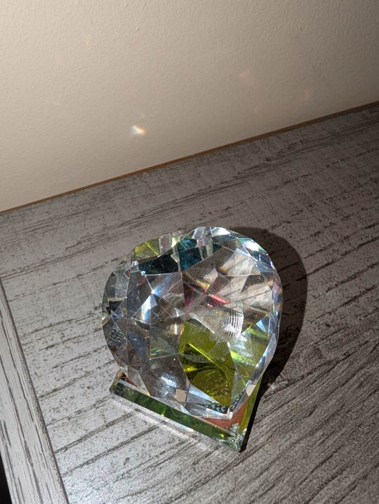 Crystal glass ornament with angel inside – rainbow light effect.