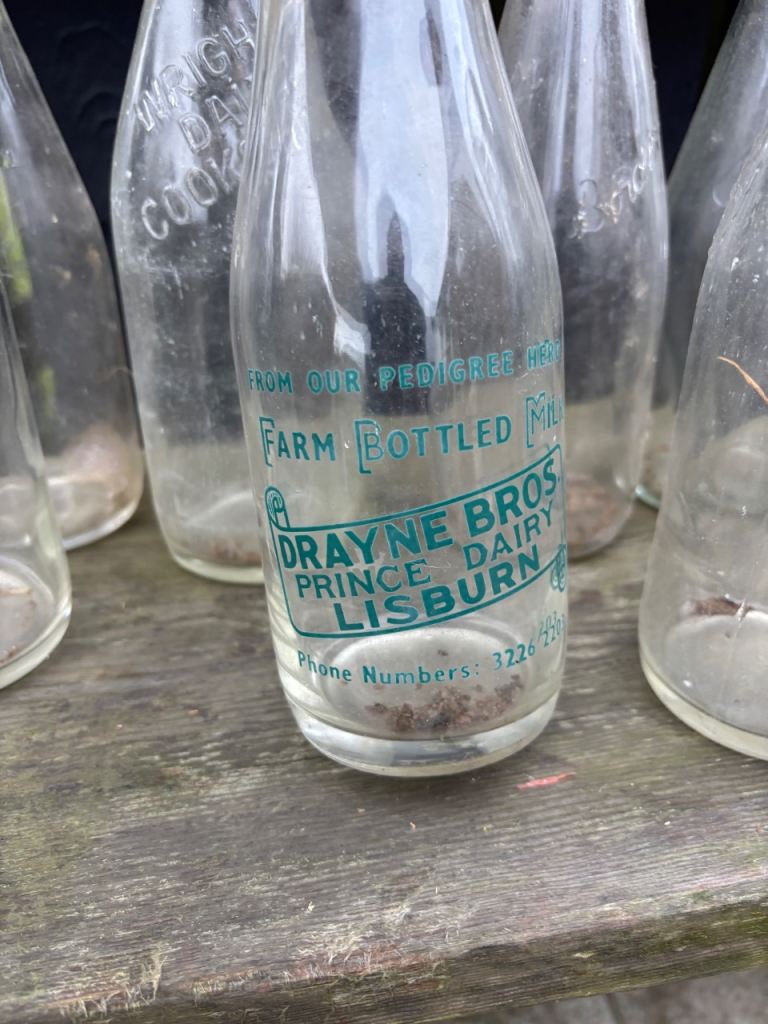 9 old glass milk bottles 