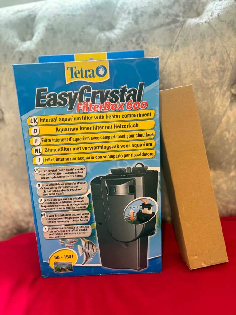 Aquarium filter with built in heater compartment and heater.