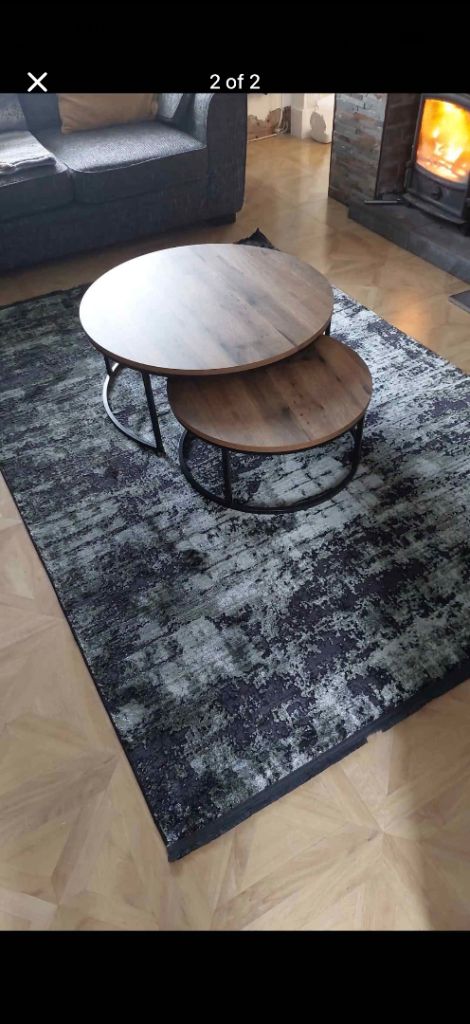 Large black and green living room rug 