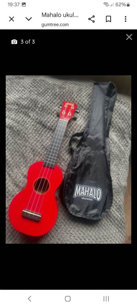 Red ukulele with carry case
