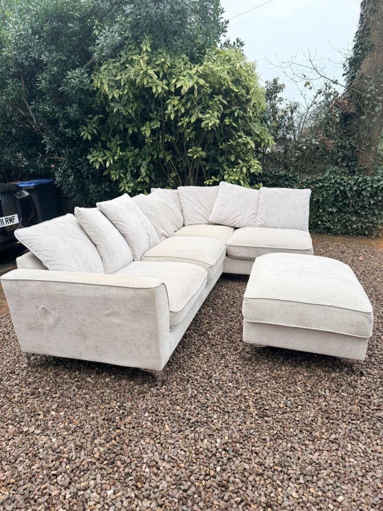 Upholstered corner sofa with a matching ottoman footstool 