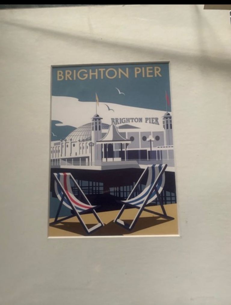 Brighton Pier Print. Art print of Brighton Pier with deck chairs.