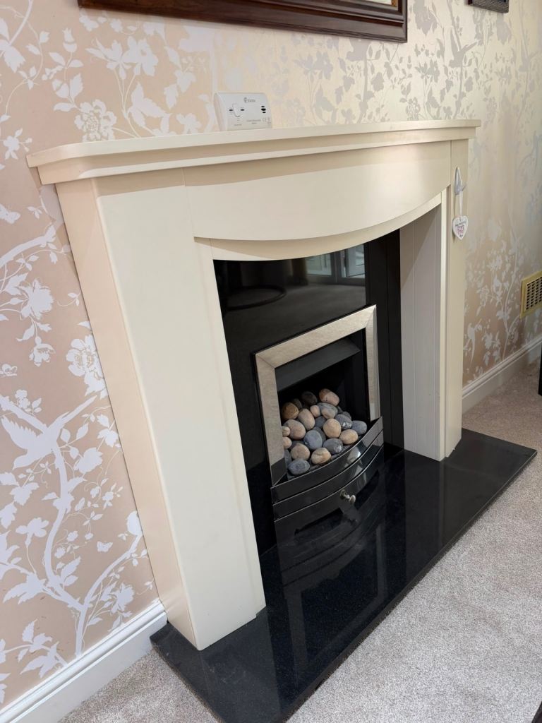 Cream Fireplace with Black Marble Hearth and Electric Fire