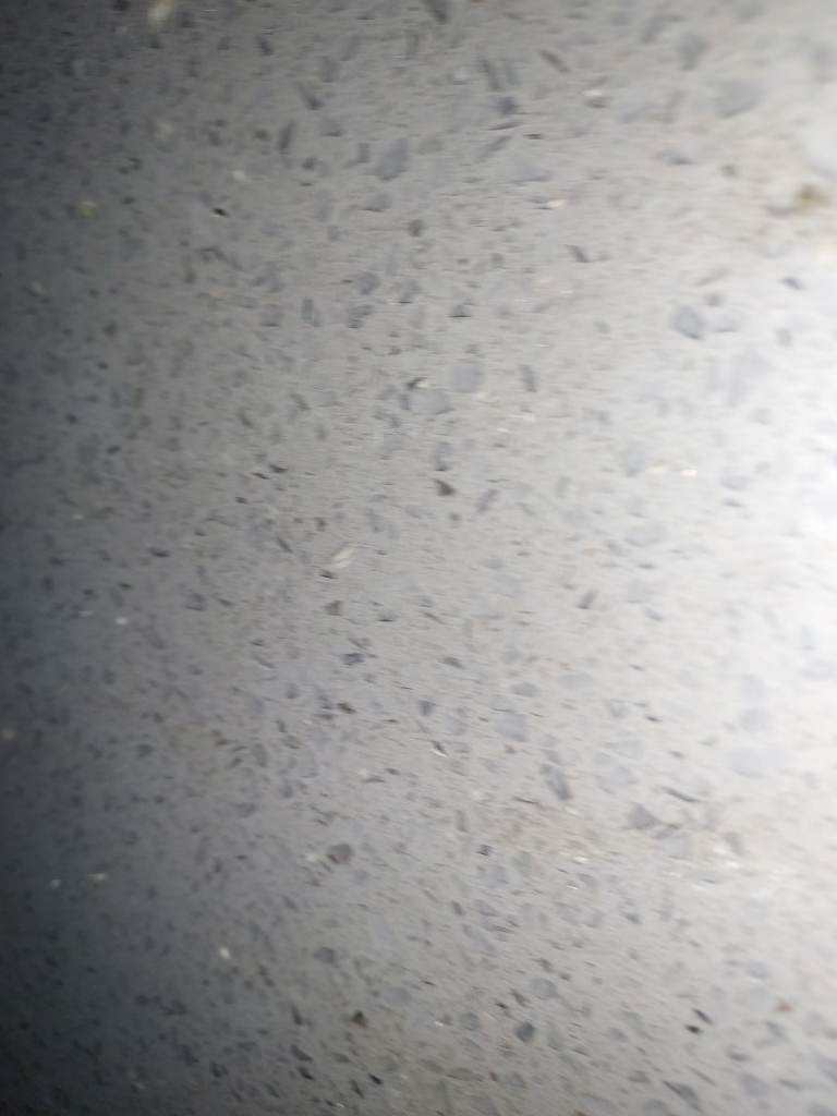 Quartz countertop and new black floor tiles