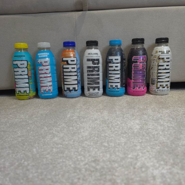 27 Empty Prime Bottles & 7 Cans for display or collection