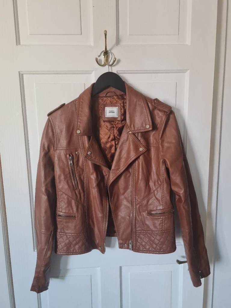 Brown Faux Leather Biker Jacket with zip detailing and quilted sections.