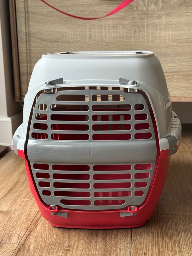 Red and grey pet carrier for small animals