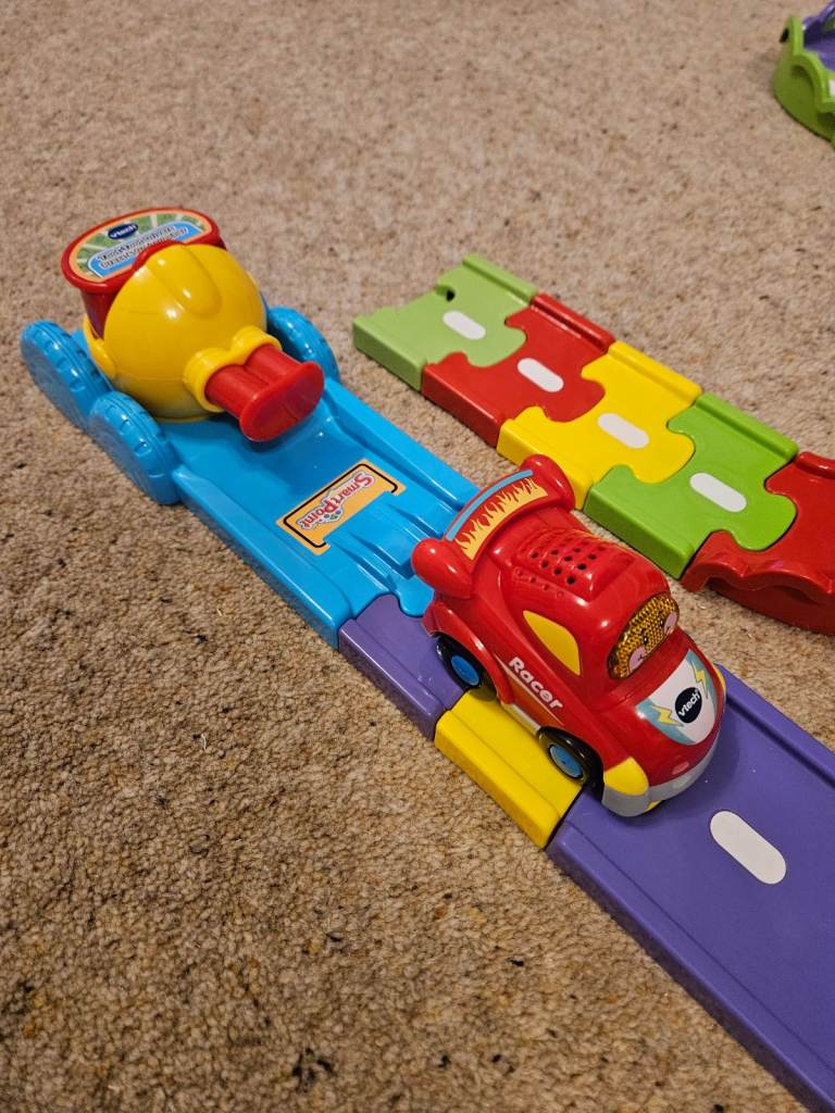 Vtech Toot toot track with 3 cars and launcher. Monster truck, bus and race car.