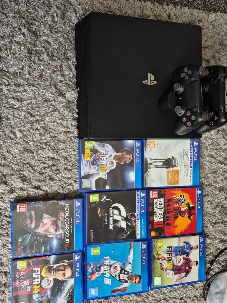 Sony PlayStation 4 Pro Console with Controller & 7 Games