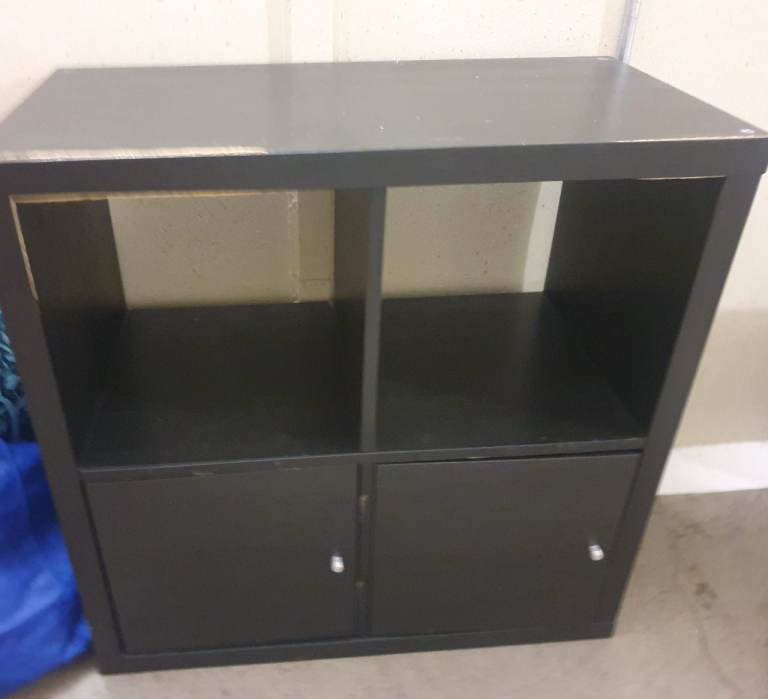 Black storage unit with cupboards