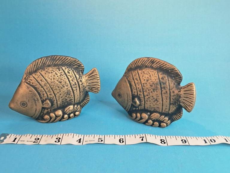 These items appear to be vintage brass fish decorative objects